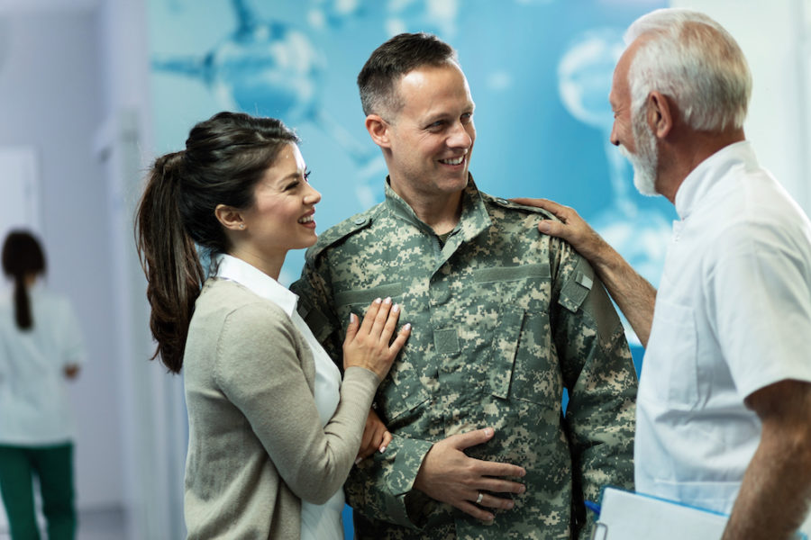 military veteran and wife meeting with doctor