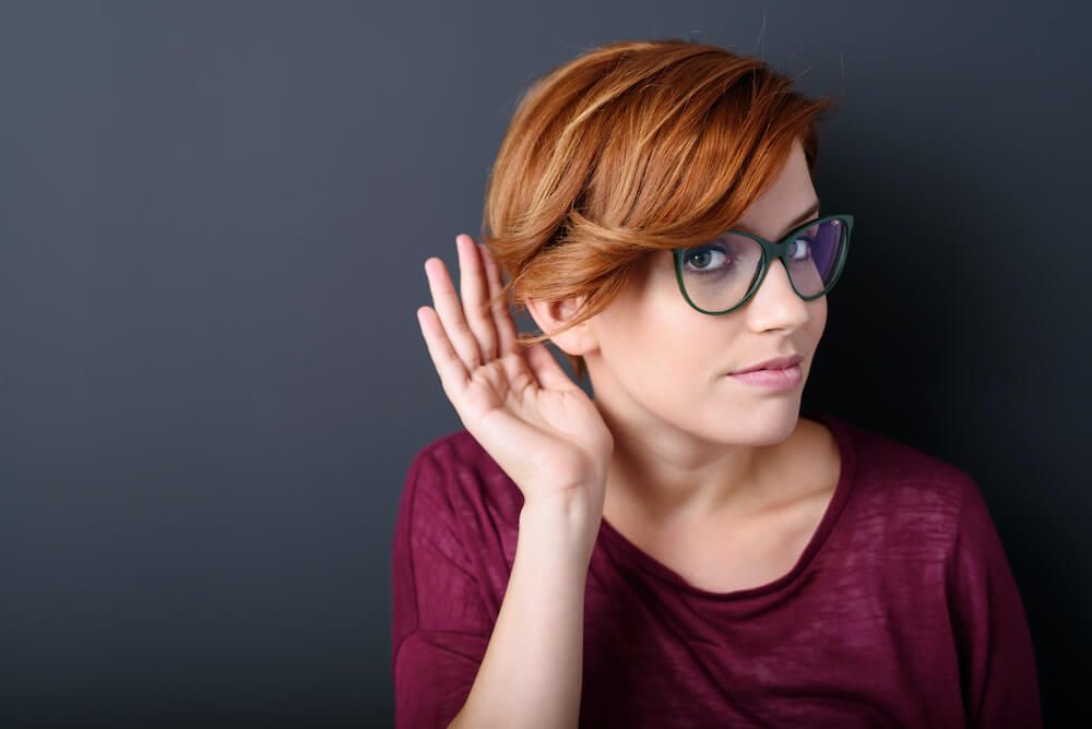 woman listening with her right ear